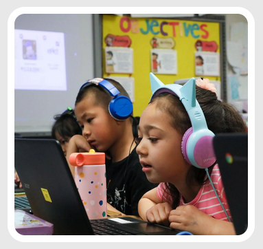 Students with headphones on in class