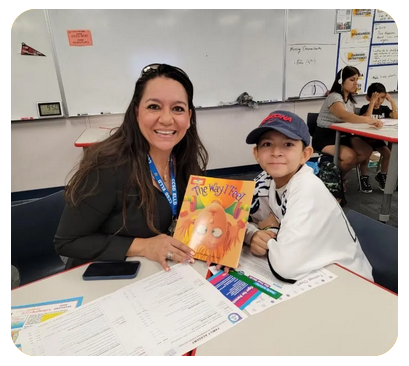 Teacher with student in class